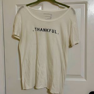 White shirt sleeve T-shirt sz xs/s. Runs big. 18 inch chest